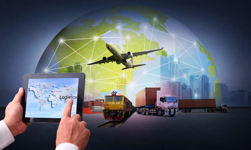 photo of man working on LTL-TL shipping services on tablet with globe, a plane, train and trucks in background