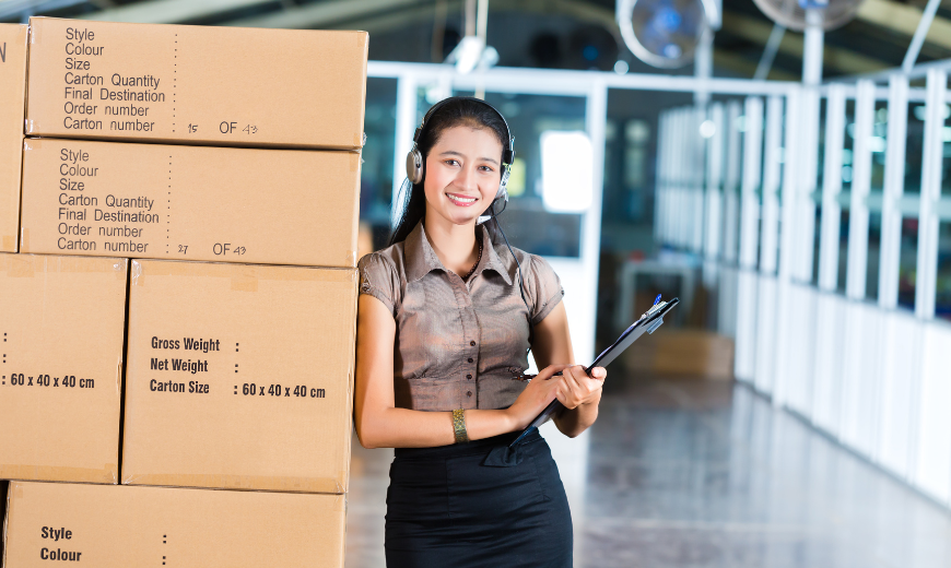 photo of a woman leaning on loaded boxes performing 3PL logistics services.